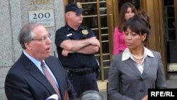 Robert Baum (left), an attorney for accused Russian spy Anna Chapman, talks to reporters in front of the New York Federal Court building after all 10 suspects pleaded guilty to lesser charges on July 8.