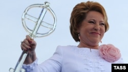 St. Petersburg's governor Valentina Matviyenko with a giant glass key at the opening ceremony of new cruise passenger terminal in St. Petersburg on May 27.