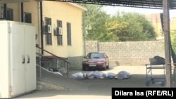 Bodies lie on the ground outside the morgue in the southern Kazakh city of Shymkent on August 13.