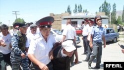 Opposition Bloc supporters are arrested after trying to crash President Bakiev's campaign stop in Talas on June 18.