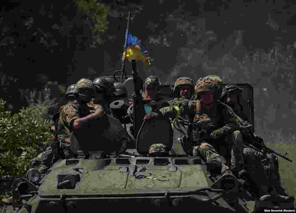 Ukrainian soldiers ride on an armored personnel carrier (APC) to a position in the Donetsk region. Moscow has shifted its attacks to Donetsk, having largely seized control of the Luhansk region, and is focusing on Kramatorsk and Slovyansk.