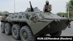 Uzbek security forces are seen on the streets of street in Nukus, capital of the northwestern Karakalpakstan region, following protests in early July.