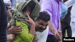 Security officials surround Rimsha Masih after her release from jail in September.