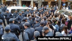 Some 50-60 people, mostly women, gathered in central Baku after police blocked the route of their planned march.