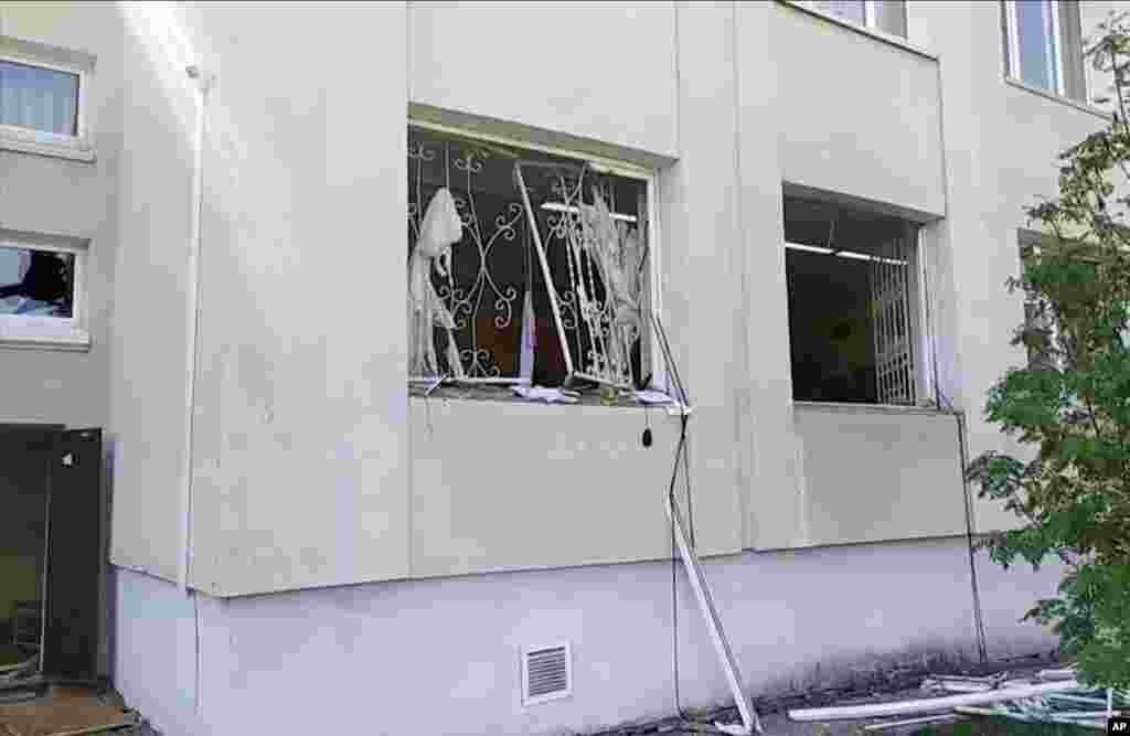 The damaged windows of the school can be seen in this image taken from video.