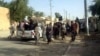 Militant Iraqi Sunni gunmen are seen on a street in the northern city of Tikrit on June 11. 