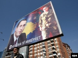 A giant billboard shows former Kosovar Prime Minister Ramush Haradinaj in Pristina in March 2008.