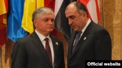 Armenia's Edward Nalbandian and Azerbaijan's Elmar Mammadyarov meet on the sidelines of a NATO summit in Lisbon in November 2010.