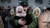 A mobilized Russian soldier in the Tyumen region says goodbye to his loved ones as he departs for the war in Ukraine. (file photo)