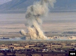 Smoke billows from a bomb dropped by U.S. forces on Taliban positions in October 2001.