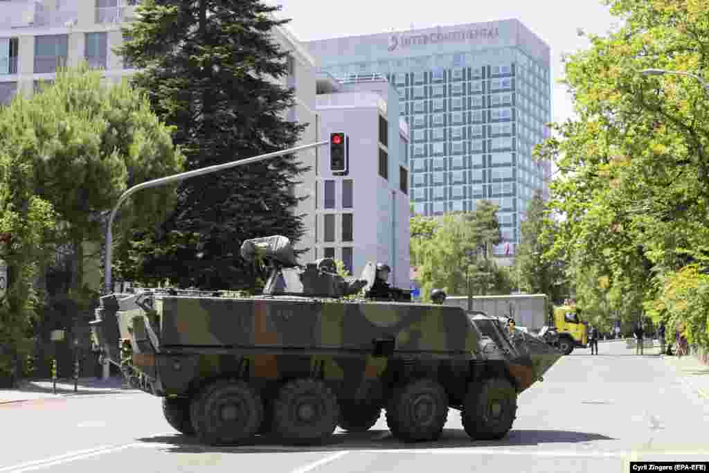 An armored vehicle stands in front of Geneva&#39;s InterContinental hotel, where Joe Biden is staying, on June 15.&nbsp;