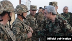 Armenian President Serzh Sarkisian meets with soldiers on frontline duty in Nagorno-Karabakh in October 2012.