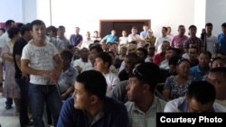 Kazakhs at a courthouse in Aqtau await verdicts in a case concerning riots in the town of Shetpe late last year. 