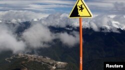 Slippery slope? The Olympic village in the mountain ski resort of Rosa Khutor is seen from Rosa peak of Aibga mountain, some 40 kilometers east of Sochi, the site of the 2014 Winter Olympics.