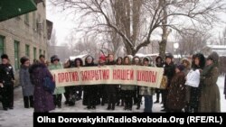 Parents and teachers protest against the closing of a Ukrainian language school in Donetsk.