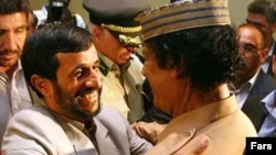 Those were the days: Iranian President Mahmud Ahmadinejad (left) and then Libyan leader Muammar Qaddafi embrace at the United Nations