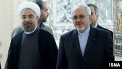 Iranian President Hassan Rohani (left) has handed over responsibility for nuclear negotiations to his foreign minister, Mohammad Javad Zarif (right), perhaps signaling a more flexible approach.