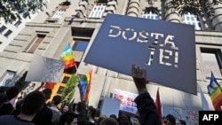 Serbian gay activists display a banner that says "That's enough!" during a protest in front of the government building in Belgrade last year.