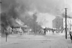 A town in southern Finland burns after a Soviet air attack.