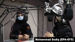 Afghan women journalists participate in a broadcast at a radio station in Kandahar in December 2020.