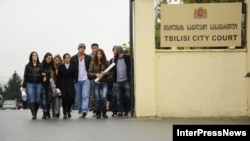 Supporters of former Interior and Defense Minister Bacho Akhalaia arrive at a city court building in Tbilisi on November 9.