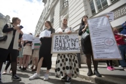 Members and supporters of the Chechen community demonstrate in Vienna on July 7 after the killing.