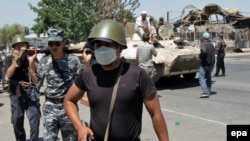 Kyrgyz servicemen patrol in Osh. The EU has warned that instability could spread throughout the region.