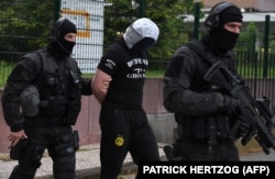 French arrest a high-school friend of Azimov in Strasbourg on May 13.