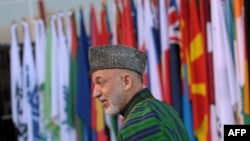 Afghan President Hamid Karzai arrives at the start of the Afghanistan conference in Bonn on December 5.