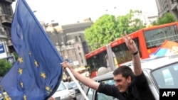 A man waves an EU flag in Belgrade after Serbia signed the bloc's Stabilization and Assocation Agreement in 2008.