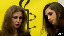 Maria Alyokhina (left) and Nadezhda Tolokonnikova of Pussy Riot appear at a news conference in New York on February 4.