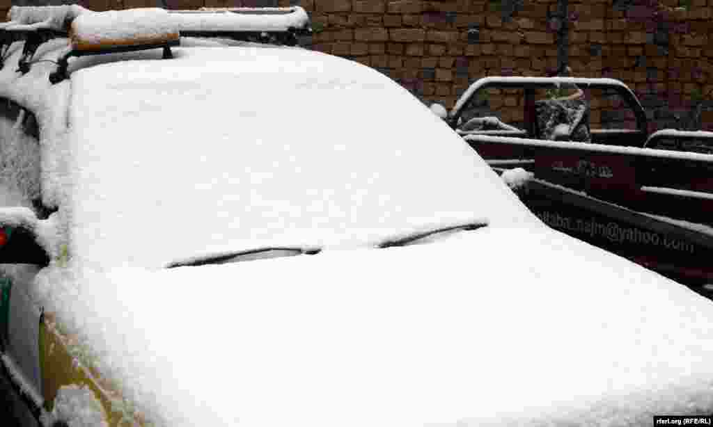 A rare sight: snow accumulates on cars in Kandahar, Afghanistan.