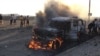 A truck that belonged to Shi'ite Muslim rebels burns during clashes in Aden on March 26.