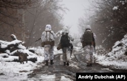 Ukrainian soldiers patrol near the line of separation from the separatists in the Donetsk region.