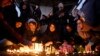 Iranians light candles for victims of the plane crash as they protest in front of Amir Kabir University in Tehran on January 11. 