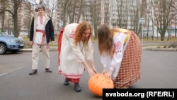 Women in national garb roll out a pumpkin in front of the Russian Embassy in Minsk on December 5 in a protest over possible deepening integration. In local custom, when a woman presents a man with a pumpkin, she's telling him he's undesirable.