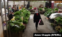 A woman shops for groceries in the Batumi Bazaar.