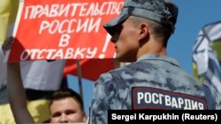 A man attends a protest over the government's decision to increase the retirement age in Moscow on July 29.