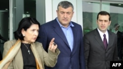 Opposition leaders Salome Zurabishvili, Levan Gachechiladze, and Irakli Alasania (left to right) leave their meeting with President Mikheil Saakashvili in Tbilisi.