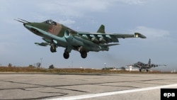 A Russian SU-25 strike fighters takes off from the Hmeymim airbase, outside Latakia in Syria. The emergence of the self-declared Islamic State extremist group in the region has allowed Moscow to intervene in the Syrian conflict under the guise of combating the group's horrific atrocities.