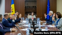 The government led by Prime Minister Maia Sandu (center) meets in the parliament building in Chisinau on June 10.