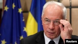 Ukrainian Prime Minister Mykola Azarov awaits the start of a European Union-Ukraine cooperation council in Brussels on May 15.