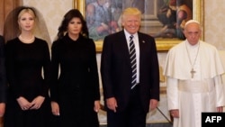 Pope Francis (right) stands with U.S. President Donald Trump, his wife, Melania, and his daughter Ivanka during a private audience at the Vatican on May 24.