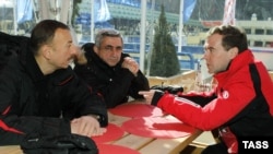 Russian President Dmitry Medvedev (right) meets with his Azerbaijani and Armenian counterparts Ilham Aliyev (left) and Serzh Sarkisian in the Russian ski resort of Krasnaya Polyana on March 5.