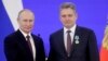 Former Bulgarian deputy Nikolai Malinov (left) receives a state award from Russian President Vladimir Putin in 2019. 