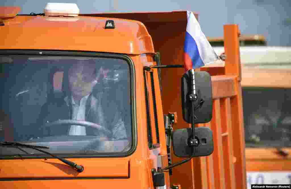 Russian President Vladimir Putin drove a Kamaz truck across the bridge on May 15 to officially open the span.