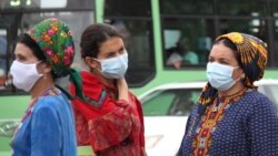 People wearing protective face masks in Ashgabat on July 13.