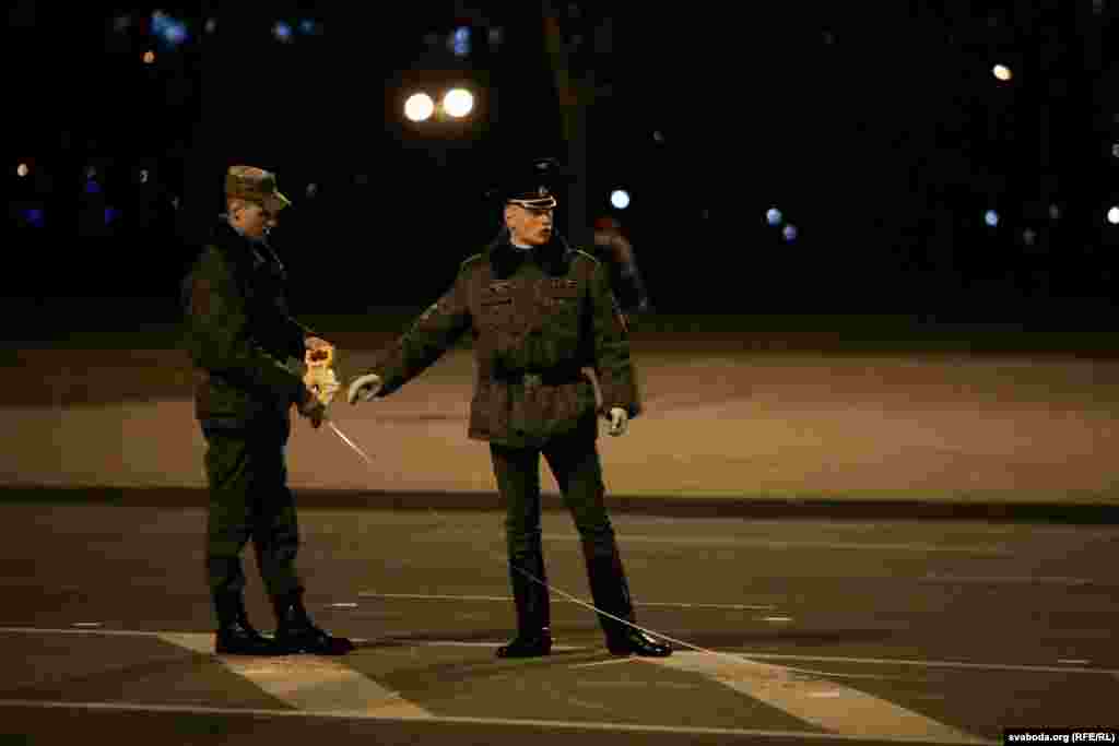 Soldiers mark the area for the parade.&nbsp;