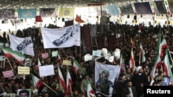 Government supporters demonstrate at the February 16 funeral of Sanee Zhaleh, a student who was shot dead during opposition protests in Tehran on February 14.