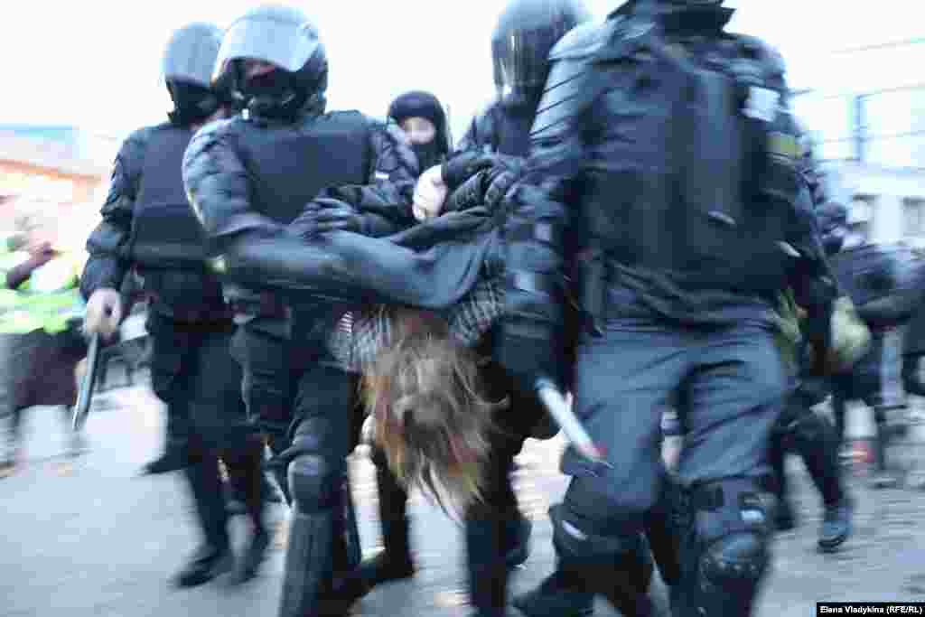 A protester is hauled away by St. Petersburg police.